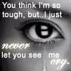 Black-and-white close-up of a human eye with text overlay, featuring a crying face emoji in the pupil and visible tears streaming down the cheek.