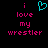 Pixelated text reads 'i love my wrestler' in pink with a cyan heart symbol above the first 'i', displayed on black background.