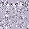 A static grayscale image of four symmetrical snowflake-like patterns arranged in a 2x2 grid on a light gray background.