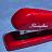A 48x48 pixel animated contact sheet showing three frames of a red stapler with text overlays on blue and gray backgrounds.