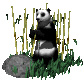 Pixelated panda in black-and-white sits among bamboo and grass, holding a stalk with both hands near a gray rock.