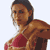 Pixelated static image of a woman with dark hair tied back, wearing a red bikini top and brown jacket over her shoulder, facing left against white background.