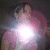 A pixelated image of a person in pink clothing with bright light effects, featuring text reading 'michelle (' at the bottom.