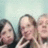 Pixelated image of multiple people with text overlay reading "We're So Kool!" on a light blue background.