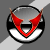 Animated sequence showing a green cartoon character with red eyes and horns emerging from a circular emblem with red and black accents.