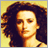 Pixelated image of a person with curly hair against a yellow background, next to golden text reading 'SAHARA' on a brown backdrop.