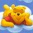 Pixelated yellow bear with red shirt lying on white cloud against blue sky background.