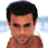 Static pixelated image of a shirtless male figure with short dark hair against a light blue gradient background.