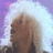 Pixelated image of a person with light brown hair against a purple and white background.