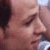 Pixelated close-up of a person's face showing closed eyes, nose, and mouth with visible skin texture and partial dark hair on the left side.