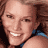 Static 48x48 pixel icon showing a close-up of a person's face with light skin tone, brown hair, and visible teeth in a smile, wearing a blue garment on the shoulder.