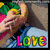 Animated sequence showing a person in a blue shirt with colorful 'Love' text, a green heart-shaped candy with 'KISS ME', and a pink background with 'dude I heart you' text.