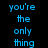 Blue pixelated text on black background with blue patterned lower section, displaying 'you're the only thing that i like about me..'