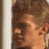 Static 49x49 pixel icon showing a close-up of a person's face with brown hair and light skin tone, partially cropped on the right side against a dark background.