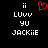 Pixelated black background with white text and a red heart symbol, showing 'ii' above 'LUvv', 'yu', and 'JACKiIE' in a vertical arrangement.