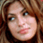 A 48x48 pixel buddy icon split into two frames showing a woman's face on the left and green text on a dark background on the right, with visible pixelation and dithering effects.
