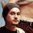 Static 48x48 pixel buddy icon showing a person with brown hair and light skin wearing a dark top, partially cropped on the left side against a light blue background.