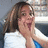 A pixelated image shows a person with long brown hair in a white top, hands clasped near their face, next to black background with white text reading "i love domingue x infinity".