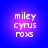 Four identical pixelated text icons arranged in a on a blue background with purple gradient halos, each displaying 'miley cyrus roxs' in white block letters