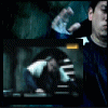 Animated sequence showing a person in dark clothing performing hand gestures against a striped background with blue and gray tones.