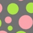 Static pattern of overlapping pink and green circles on a dark gray background with no visible text or motion.