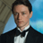 A pixelated contact sheet showing two frames of an animated icon featuring a man in formal attire and the text "ROBBIE" on a textured background.