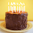 Pixelated birthday cake with lit candles on a plate, next to green background text reading 'It's my Birthday!' in pink letters.