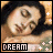 nine identical images showing a woman with closed eyes resting her head on an arm, surrounded by small white crosses on a warm-toned background with the word DREAM below
