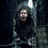 A pixelated image of a person in a dark, cave-like setting with a bright light source above, accompanied by yellow text asking if someone needs a hug.