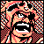Pixelated static icon featuring a stylized character face with exaggerated mouth and eyes, surrounded by red/orange checkered patterns on black background.