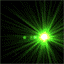Green starburst effect with central bright light radiating rays, accompanied by shifting green shapes on dark background.