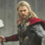 Static 64x64 pixel icon of a character with long blonde hair, red cape, and dark armor holding a hammer-like object against a gray background.