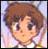 Pixelated cartoon-style face with brown hair, large dark eyes, and a neutral expression against a light gradient background.