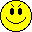 Four yellow pixelated smiley faces arranged in a , each with distinct facial features and expressions on a gray background