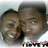 Two people in close proximity with one person's head slightly turned, smiling, with text below them.