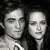 Two grayscale pixelated faces side-by-side with closed eyes, dark hair on left face, light clothing visible on lower portion of image.