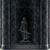 Pixel art statue of a robed figure holding a sword, set within a dark arched niche framed by vertical columns.
