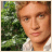 A pixelated image of a person with light hair and a white shirt against a green background, with "MJ" text appearing in different positions across frames.