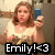 A pixelated image shows a person holding a blue phone with text 'Emily! <3' overlaid, next to a peace symbol on a gray background.