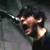 A static image with a small inset photo of a person with dark hair and a dark shirt, alongside multiple instances of pixelated text reading "IM GONE AWAY" in red and white.