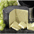 Pixelated cartoon-style icon shows a beige figure with folded arms inside a dark gray frame, with green foliage in the background; text appears in the second frame.