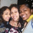 Three people pose closely together in a pixelated image with slight variations across frames.