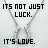 A pixelated image of a silver necklace with two interlocking pendants, overlaid with text reading "IT'S NOT JUST LUCK. IT'S LOVE." in black and blue.