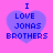 Four identical pixelated heart-shaped icons with blue text on a pink background, each displaying "I LOVE JONAS BROTHERS" in blocky font.