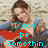 A woman with brown hair in a blue top holds a red guitar against a textured background, with cyan text reading "I can be Somethin" on the left and "Sweet or Louder Than The Radio" on the right.