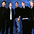 Animated contact sheet showing two frames of a group icon with five figures in black robes and one figure in blue, next to green text reading "Original Icons .com" on dark background.
