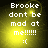 Pixelated text reads 'Brooke dont be mad at me!!!!!! :(' on a yellow gradient background with a subtle circular light effect.