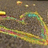 Pixelated image with a rainbow-colored heart shape on a dark background, accompanied by pink text on light pink and gray