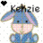 Pixelated cartoon donkey with blue body, pink cheeks, and purple ears sits against white background; text 'Kazie' appears above head.