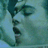 Pixelated image of a person's face in profile with closed eyes and mouth open, next to black background with white text reading 'I Love French Kisses'.